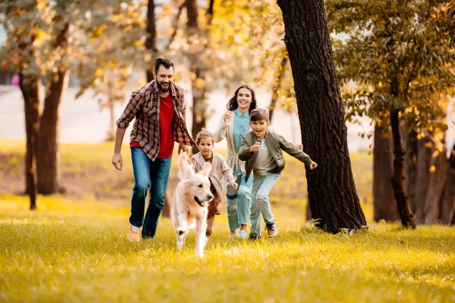 Family running with dog